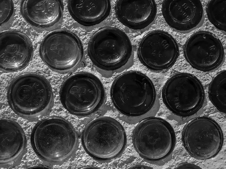 Bottles embedded in wall